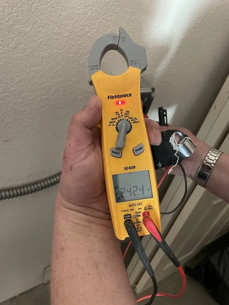 Voltage testing with clamp meter during Recessed Lighting Installation in Wrightstown